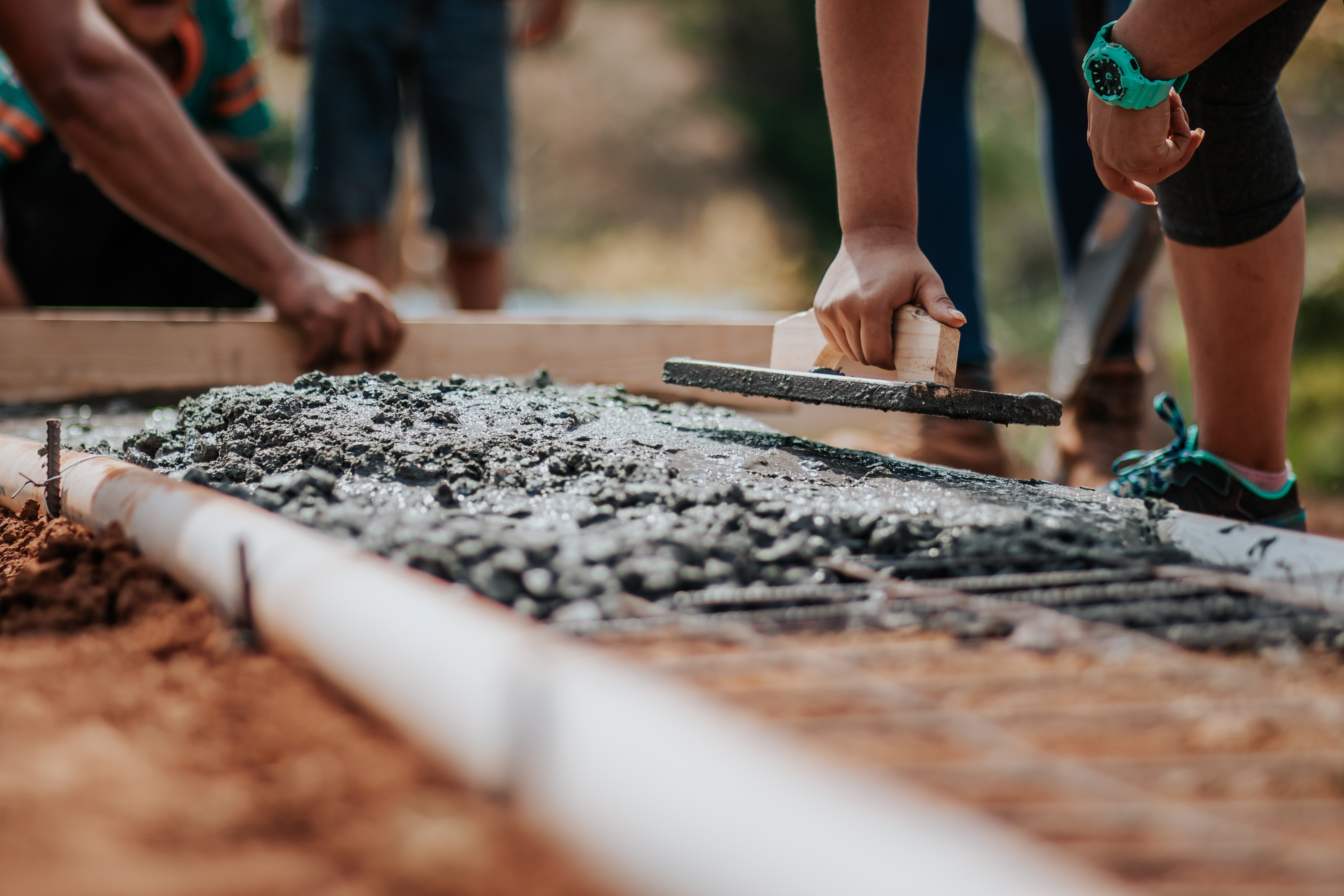 Construction worker laying foundation